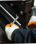 Top Shelf Stainless Steel Indexing Plunger Pin for durable securing, shown in use with gloved hand on metal fabricating equipment.