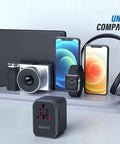 All In One Universal Travel Adapter With USB C And Four USB A Ports Worldwide Power Adapter For Over 200 Countries next to devices