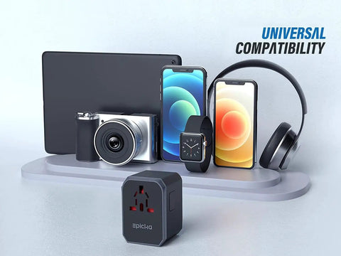 All In One Universal Travel Adapter With USB C And Four USB A Ports Worldwide Power Adapter For Over 200 Countries next to devices
