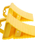 2 Pack Heavy Duty Rubber Wheel Chocks in bright yellow with grip treads and sturdy handles for RV trailer blocking.