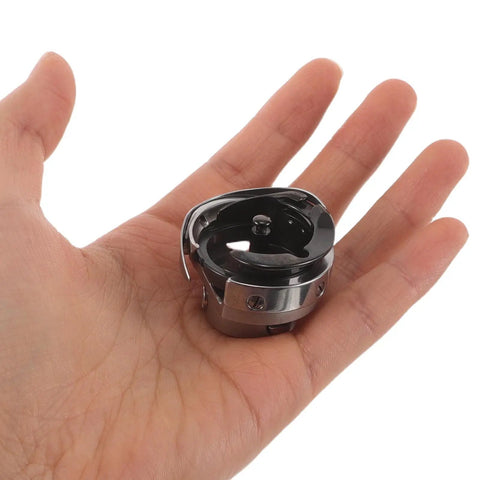 Pro Grade Metal Rotary Hook Sewing Machine Part For Flat Bed Industrial Machines With Advanced Computer Control And Precise Stitching Performance Dark Bobbin Case Accessory Designed For Heavy Duty Bulk Apparel Production And Home Use in hand