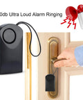 Ultra Loud 120dB Door Sensor Alarm For Home, Travel And Hotels, Touch, Vibration And Magnet Detection For Kids Safety, Luggage, Backpack, And Security, Instant Alerts When Door Opens black sensor hanging on door handle