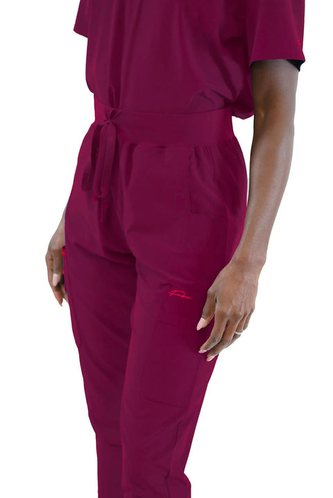 Close-up of Women's Slim High Waisted Jogger Scrub Pants Yoga Style Nursing Uniforms Wine Color Buttery Soft Healthcare Workwear.