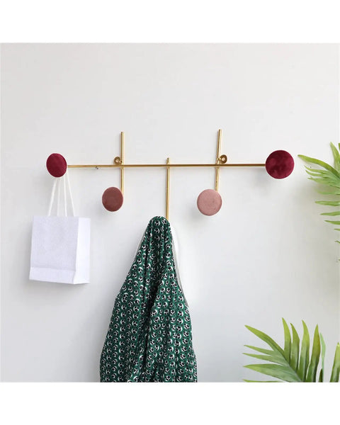 Slick Wall Mounted Coat Rack With Heavy Duty Adhesive Hooks And Key Holder For Mudroom Setup Easy Peel Design holding a green patterned jacket.
