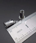 Badass M5 Rivet Insert Clinch Nuts Premium 304 Stainless Steel Flat Head Knurled Blind Hardware Locking Fasteners close-up with ruler
