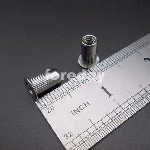Badass M5 Rivet Insert Clinch Nuts Premium 304 Stainless Steel Flat Head Knurled Blind Hardware Locking Fasteners close-up with ruler