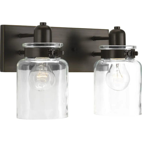 Super Cool Antique Bronze Farmhouse Two Light Bath Vanity Light With Clear Glass Shades Bringing Warm Vintage Glow