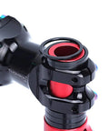 Close-up of a bicycle stem with red and black headset spacers visible, compatible for 8 Piece Aluminum Bicycle Headset Spacer Set For One And One Eighth Inch Threadless Stems Includes 2mm 3mm 5mm 10mm Spacers 2 Each Great For MTB BMX Mountain Road Bikes Lightweight Black Anodized Finish To Tweak Handlebar Height.