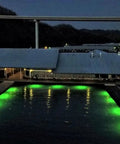 Top Shelf Green Dock Light And Fishing Lantern Waterproof Marine Grade illuminating a dock at night.