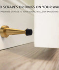 Solid Brass Door Stop With Rubber Bumper Tip, Heavy Duty Door Protector And Wall Guard In Brushed Gold Finish installed on wall