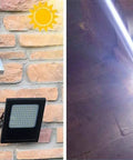 Spot Lighting Solar Floodlight Outdoor 120 Led Remote Control Solar Ga, solar panel mounted on a brick wall with floodlight.