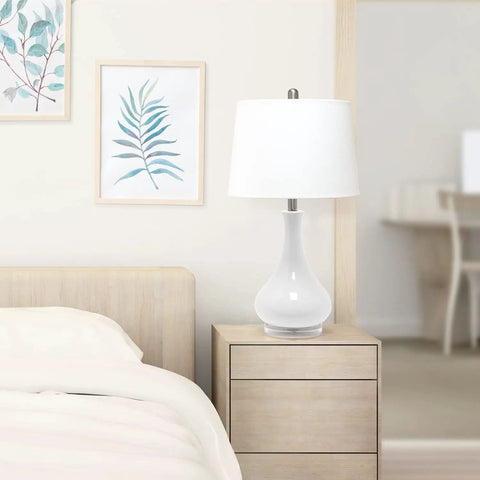 Ceramic Genie Tear Drop Table Lamp With Glossy Light Blue Base And White Fabric Shade on bedroom nightstand