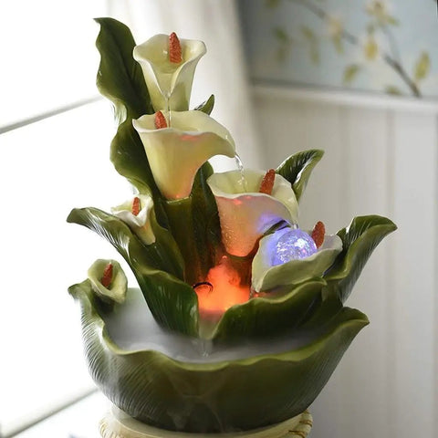Decorative multi-tier lotus water fountain with LED lights and green ceramic leaves for indoor tabletop display