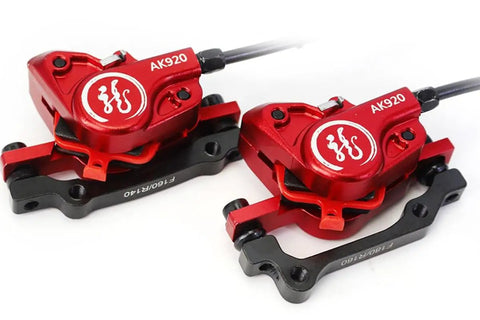 Heavy Duty Hydraulic Disc Brake Set Front And Rear With Two Piston Aluminum Calipers Long Brake Lines For Mountain Road Bicycles Sick Stopping Power close-up of red calipers.
