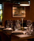 2 Pack Cordless Rechargeable LED Table Lamps With 5000mAh Battery on a restaurant table, gold finish