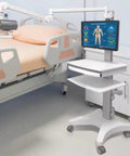 No Fuss Adjustable Height Rolling Medical Cart next to hospital bed, featuring monitor and pullout keyboard for easy access.