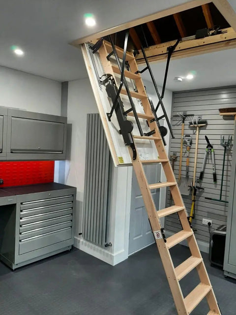 Premium Electric Attic Lift Stairs With No Sweat Remote Control Built Rugged Beech Wood Frame For Homes 7 Feet 10 Inches To 9 Feet 6 Inches Tall visible in modern garage setting.