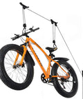 Orange bike hoisted by heavy duty ceiling bike mount and pulley system for garage steel bike lift hoist with safe lock