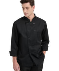 Kick Your Cooking Up With This Slick Long Sleeve Chef Coat Featuring Breezy Breathable Fabric Double Breasted Buttons And A Handy Sleeve Pocket Snag This Solid Black Restaurant Uniform For Intense Kitchen Heat Shift Ready Wear. Model wearing black long sleeve chef coat with double buttons and pocket.