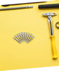 20 Pcs Lawn Aerator Shoes Pegs 5.8cm Spikes For Garden Soil Aeration And Grass Care with hammer and tools on yellow background
