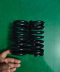 Heavy Duty Compression Springs Set, high tensile steel coils, 135mm length, 65mm outer diameter, on green surface.