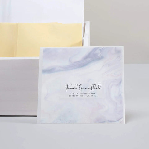 Dead On Printing Results With These Premium Printable Address Labels 1 By 2 5/8 Inches Matte Clear 300 Count Featuring Sure Feed Technology And No Sweat Easy Peel For Flawless Mail Prep Everyday on a patterned envelope.