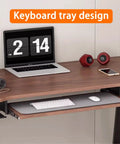 Manual Height Adjustable Standing Desk With Keyboard Tray, Four Level Sit Stand Workstation Featuring Dead Simple Adjustments And Premium Ergonomics For A Totally Sweet Home Office Setup with keyboard tray, laptop, and speakers.