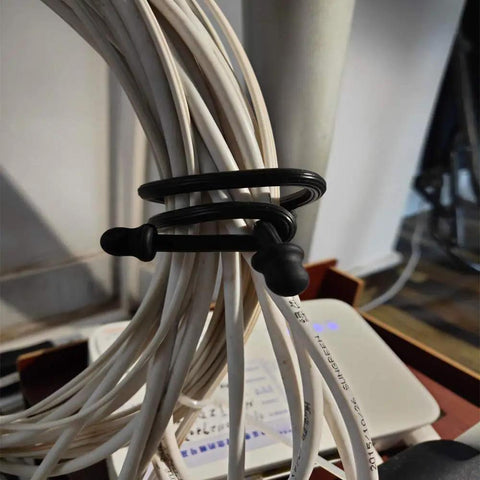 Black 12-Inch Silicone Cable Tie with Steel Core bundling white wires, part of Six Pack 12 Inch Silicone Cable Ties With Steel Core Reusable Rubber Straps In Three Colors For Organizing Cables And Wires 5mm Diameter Flexible Twist Ties For Any Project