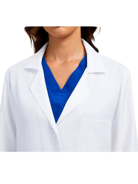 Close-up of Three Pocket Women's Lab Coat With Long Sleeves White Medical Coat Relaxed Fit Size M over blue scrubs.