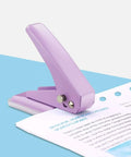 Heavy-Duty Single Hole Punch For Up To Fifteen Sheets, Metal Handheld, Purple, shown punching paper