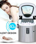 Hassle Free Countertop Ice Maker Machine Rolling Out Twenty Six Pounds Of Fresh Cubes Daily serving ice quietly near sleeping woman.