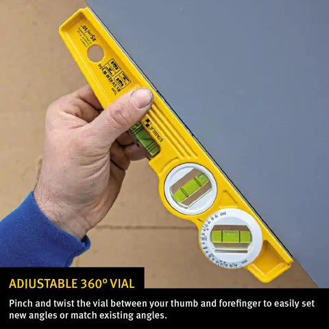 Die Cast Torpedo Level With Protractor Vial And Adjustable 360 Degree Vial held by hand showing multi vial accuracy.