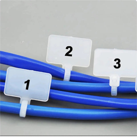 Rock Solid 100 Pack Nylon Self Locking Cable Ties With Write On Labels securing blue cables with label tags for organization