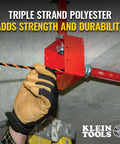 Hand gripping High Flex 75 Foot Tri Strand Polyester Fish Tape for smooth electrical wire pulling in tight spaces.