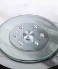 Heavy Duty Round Tempered Glass Lazy Susan With Swivel Assist Mechanism Hassle Free 360 Degree Rotation atop marble table surface.