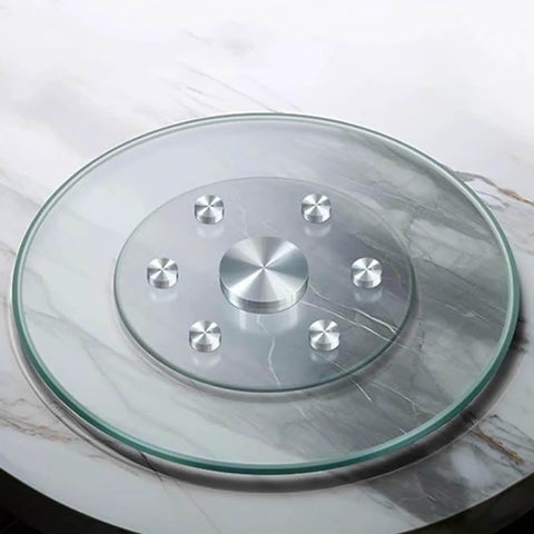 Heavy Duty Round Tempered Glass Lazy Susan With Swivel Assist Mechanism Hassle Free 360 Degree Rotation atop marble table surface.