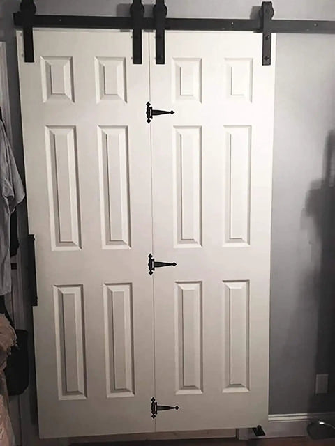 Premium Heavy Duty T Hinge For Barn Doors And Entry Gates featuring secure left or right turn options on white doors.