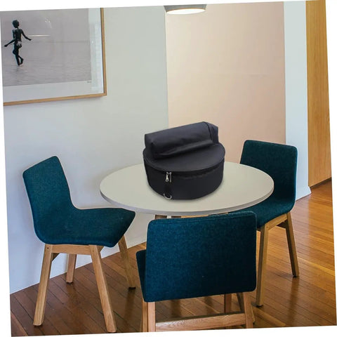 Tour Ready Waterproof Drum Backpack And Oxford Cloth Gig Bag With Padded Adjustable Straps on a table in a modern setting.
