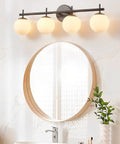 4 Light Vanity Fixture In Black Gold Finish With Milky Frosted Glass Shades, bathroom over mirror setup