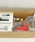 Front view of BLUEROCK 4Z1RB core drill with stand in foam packaging; red drill and manual visible.