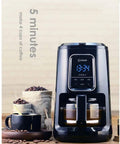 Fully Automatic Coffee Maker With Built In Bean Grinder And Smart Led Touch Display brewing coffee, holds 4 cups on kitchen counter.