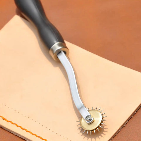 Two Pack Tracing Wheel and Pounce Wheel Set for Paper Perforation and Pattern Making shown on fabric surface