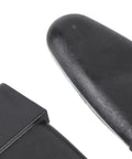 Close-up of a plastic hinge from the Rear Glass Door Hinges Kit For LEER 100XL And 100LE Truck Cap 2 Hole Design Direct Fit OEM 103528