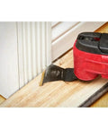 49-10-9113 9Pc Bi-Metal Oscillating Tool Blade Kit in use cutting wood floor near door frame