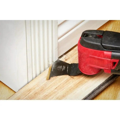 49-10-9113 9Pc Bi-Metal Oscillating Tool Blade Kit in use cutting wood floor near door frame
