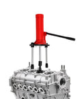 Badass 15 Ton Hydraulic Cylinder Liner Puller Kit For Universal Wet Dry Engine Sleeve Ripper extracting from a silver engine block.