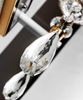 Close-up of modern minimalist wall sconce packed with clean lines and iron construction, featuring crystal accents.