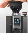 Premium Silicone Coffee Bellows Single Dose Bean Jar And Hella Handy Dust Cleanup Blower on grinder with digital display.