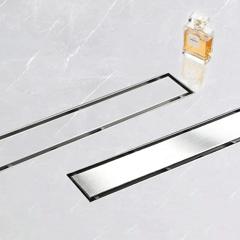 24 Inch Linear Shower Drain With Tile Insert 2 In 1 Panel Brushed 304 Stainless Steel Floor Drain placed on marble floor