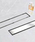28 Inch Linear Shower Drain With Tile Insert 2 In 1 Panel Brushed Stainless Steel Floor Drain shown on marble surface